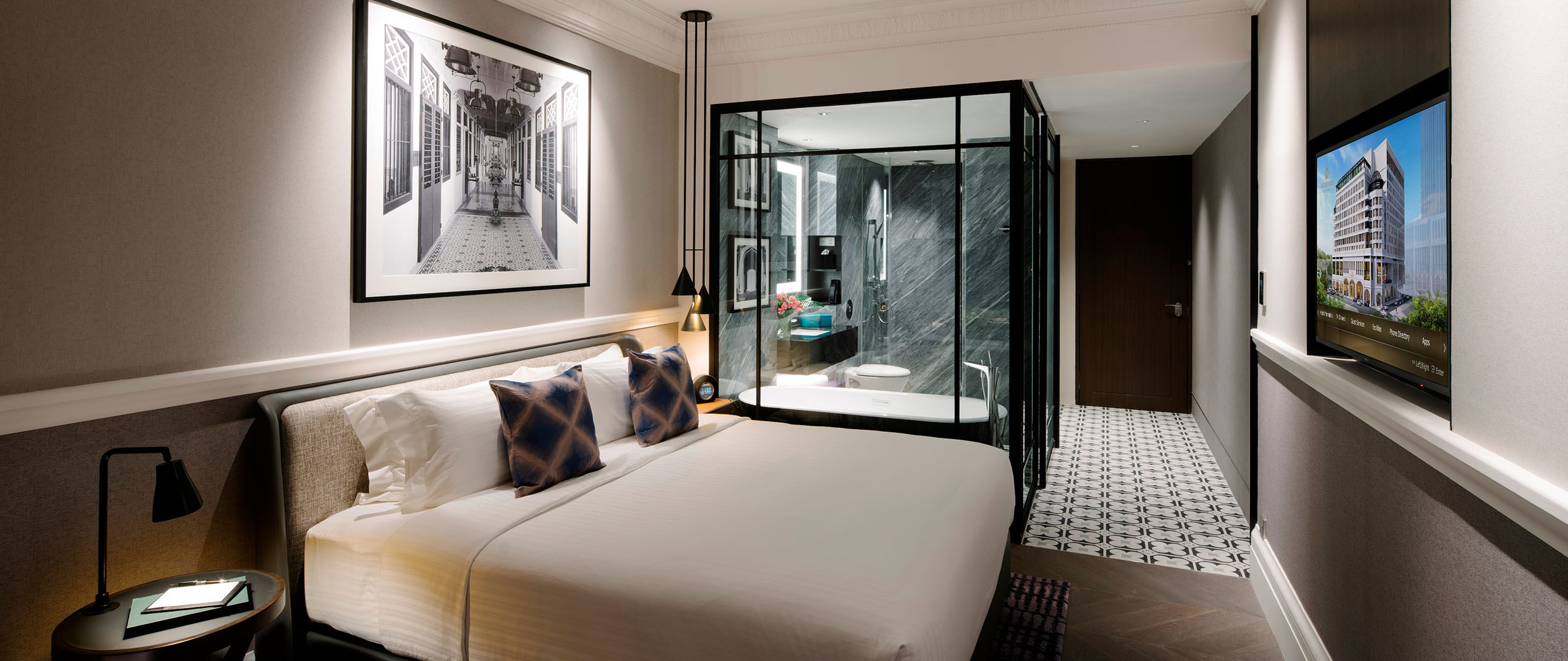 king bed with bathtub in hotel room