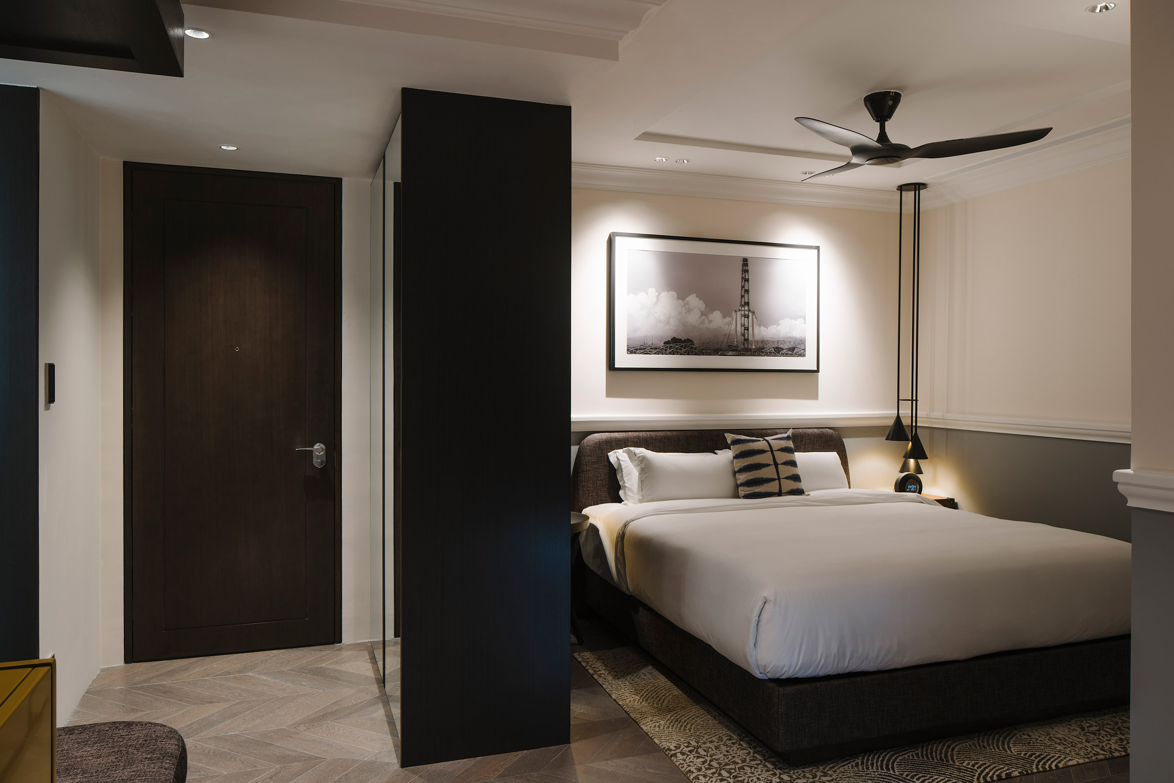 bed with ceiling fan in a hotel