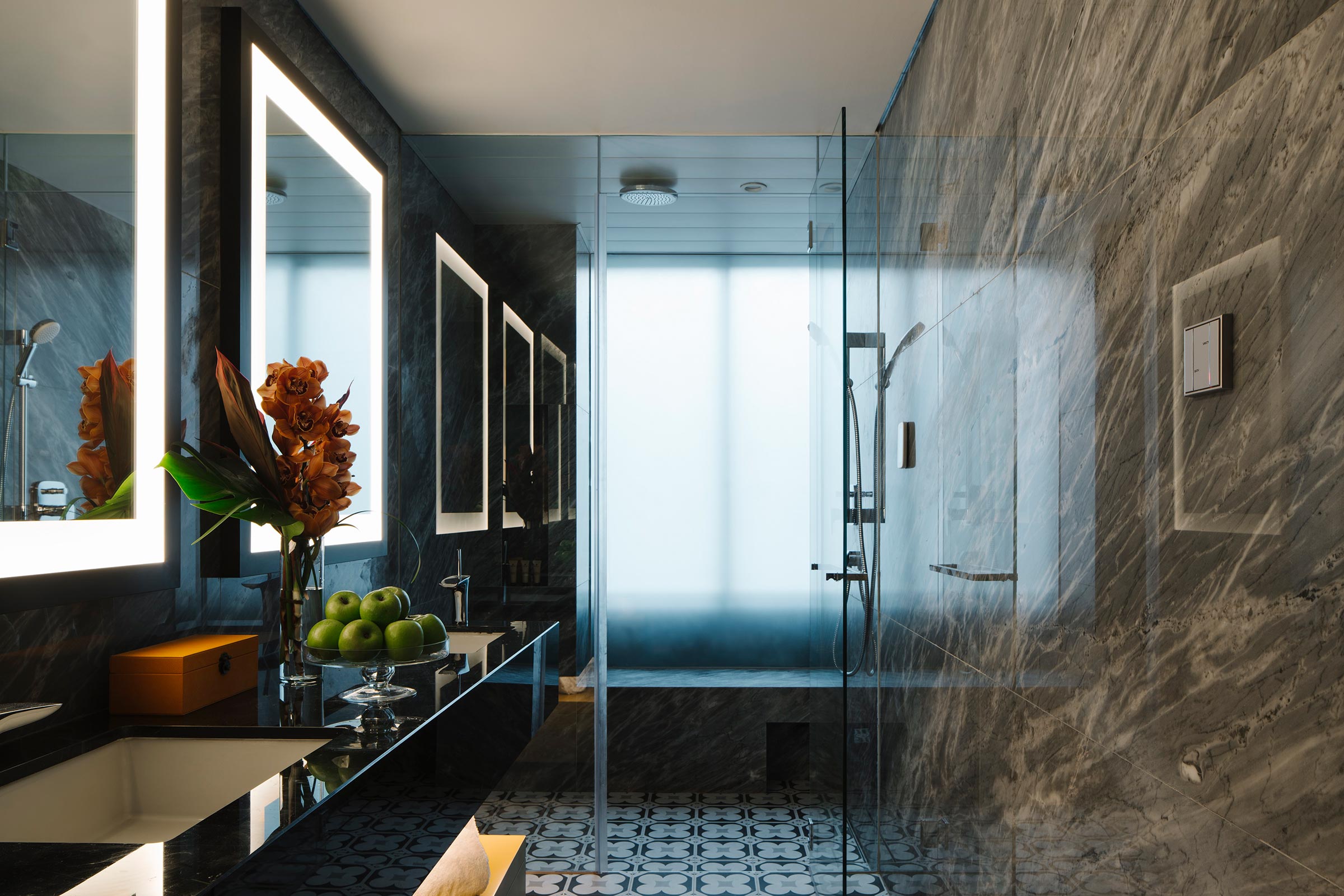 marble bathroom with steam bath and rain shower