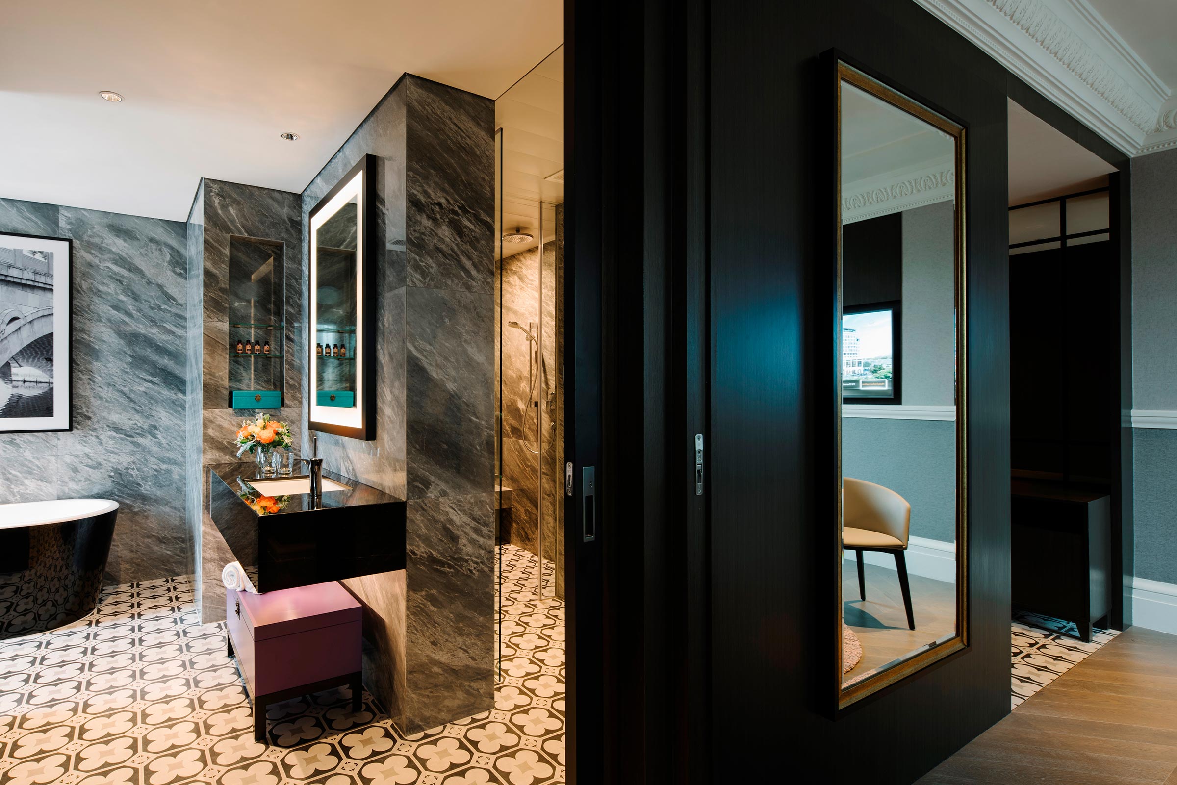 marble bathroom with sink and mirror