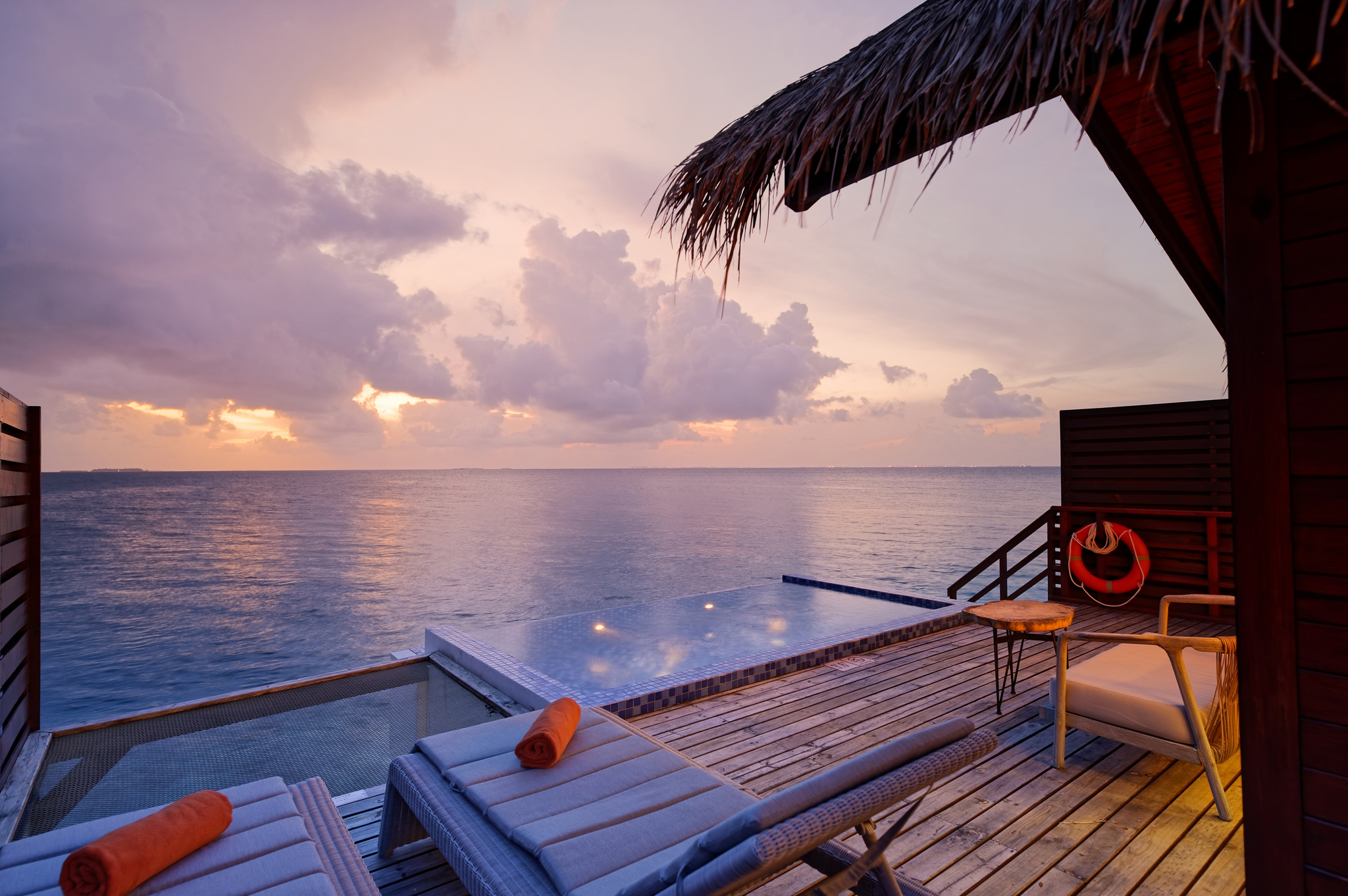 Reef Pool Water Villa Deck with pool in evening light